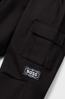 Pantaloni per bambini con fit affusolato in twill di cotone elasticizzato, Nero
