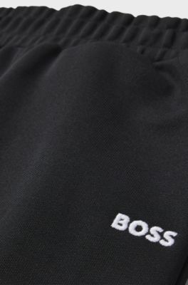 Tracksuit-byxor f&ouml;r barn med tapered fit och fiskbensm&ouml;nstrade detaljer, Svart