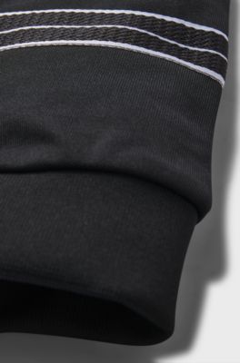 Tracksuit-byxor f&ouml;r barn med tapered fit och fiskbensm&ouml;nstrade detaljer, Svart