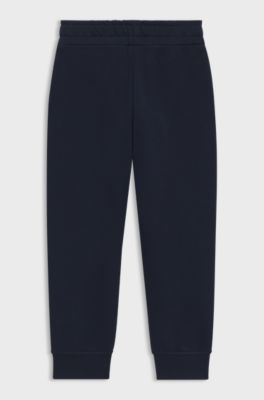 Tracksuit-byxor f&ouml;r barn, i bomullsblandning med tryckt logga, M&ouml;rkbl&aring;