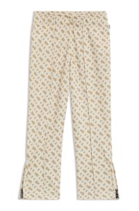 Trainingsbroek voor kinderen met monogramprint en ritszomen, Lichtbeige