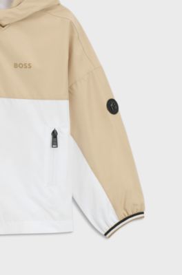 Kids-Windbreaker im Colour-Block-Design mit Kapuze und Logo-Details, Beige