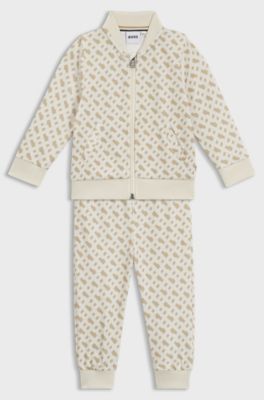 Tuta sportiva per bambini con motivo con monogramma all-over, Beige chiaro