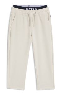 Kids' loose-fit tracksuit bottoms in stretch velvet, Light Beige