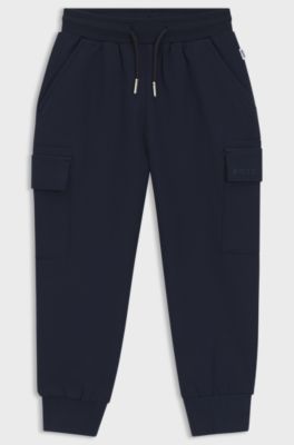 Kids' tracksuit bottoms with embroidered logo, Dark Blue