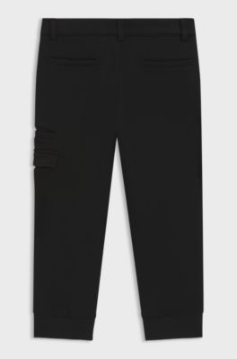 Kids' tracksuit bottoms in stretch piqu&eacute; with logo print, Black