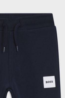 Pantaloni della tuta in pile per bambini con etichetta con logo, Blu scuro