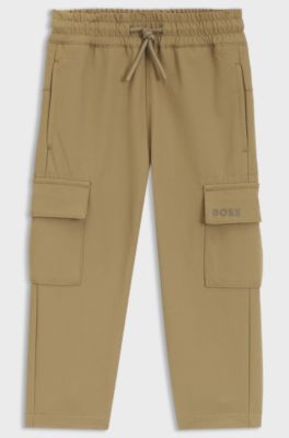 Kids' tracksuit bottoms in crinkled fleece with cargo pockets, Brown