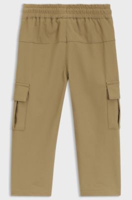 Kids' tracksuit bottoms in crinkled fleece with cargo pockets, Brown