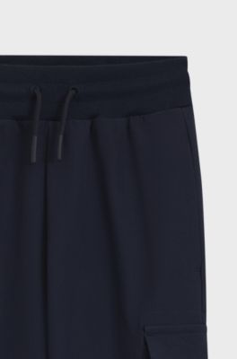 Kids' tracksuit bottoms with cargo pockets, Dark Blue