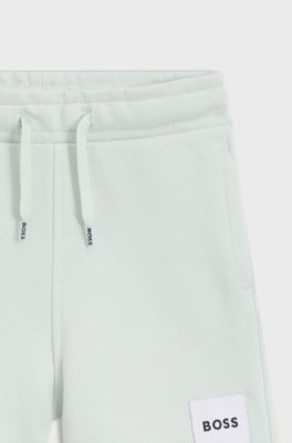 Kids' fleece shorts with logo label, Light Green
