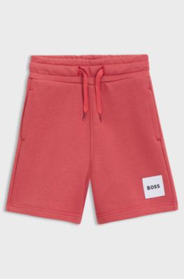 Kids' fleece shorts with logo label, Red