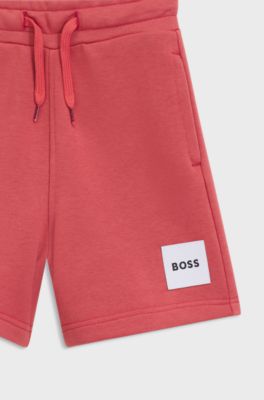 Kids' fleece shorts with logo label, Red