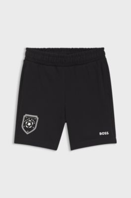 Kids' shorts with football artwork, Black