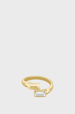 Gold-tone ring with baguette crystal and logo, Gold tone