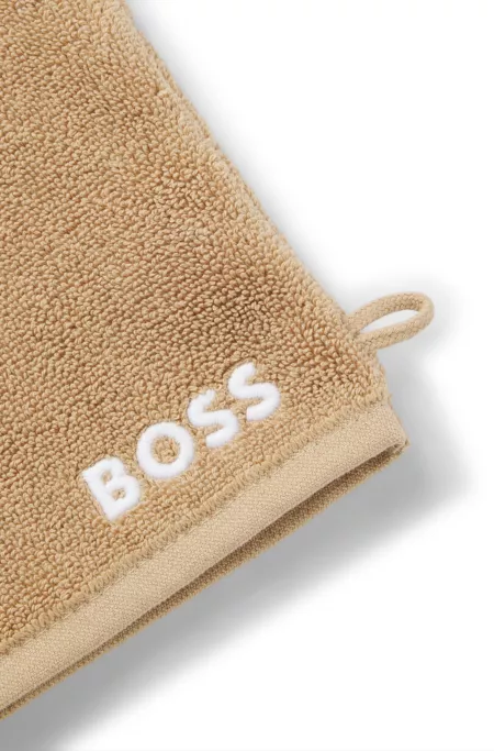 Manopla de baño de algodón con logo bordado en contraste