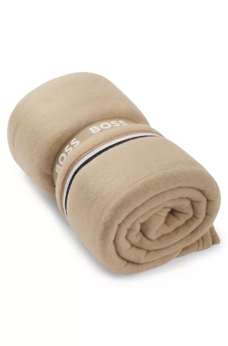 Fleece throw with signature-stripe appliqué