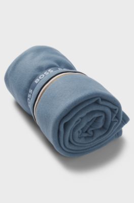 Fleece throw with signature-stripe ribbon, Light Blue