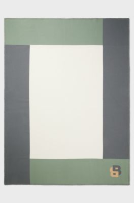 Jacquard throw with whipstitching, Patterned