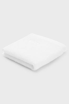 White cotton face cloth with embroidered logo, White