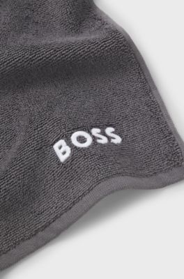 Cotton face cloth with contrast embroidered logo, Dark Grey