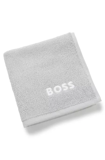 Cotton face cloth with contrast embroidered logo