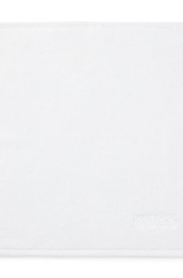 Cotton face cloth with contrast embroidered logo, White