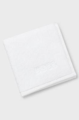 Cotton face cloth with contrast embroidered logo, White