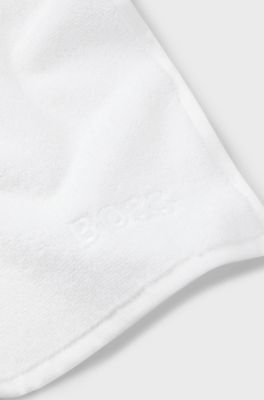Cotton face cloth with contrast embroidered logo, White