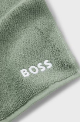 Cotton face cloth with contrast embroidered logo, Green