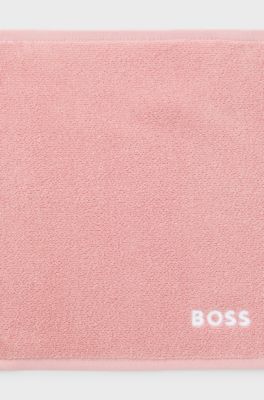 Cotton face cloth with contrast embroidered logo, light pink