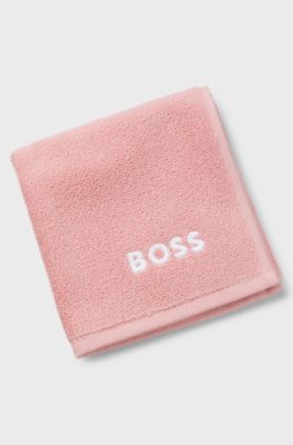 Cotton face cloth with contrast embroidered logo, light pink