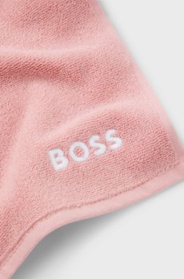 Cotton face cloth with contrast embroidered logo, light pink