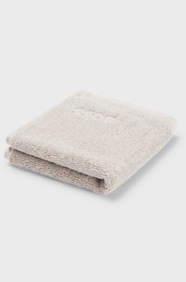 Aegean-cotton face cloth with tonal logo, Beige