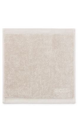 Aegean-cotton face cloth with tonal logo, Beige