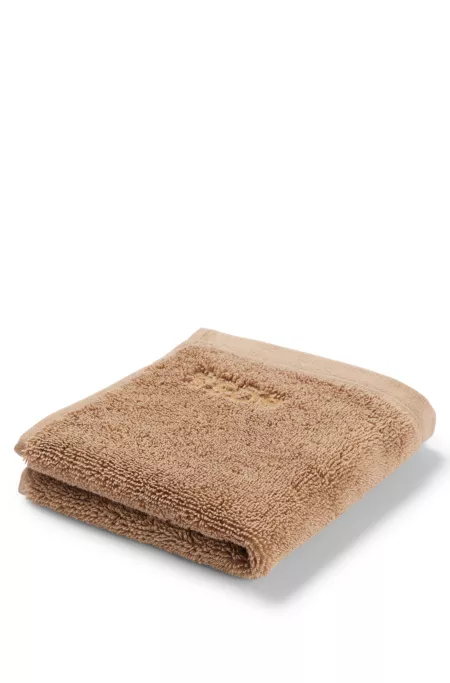 Aegean-cotton face cloth with tonal logo
