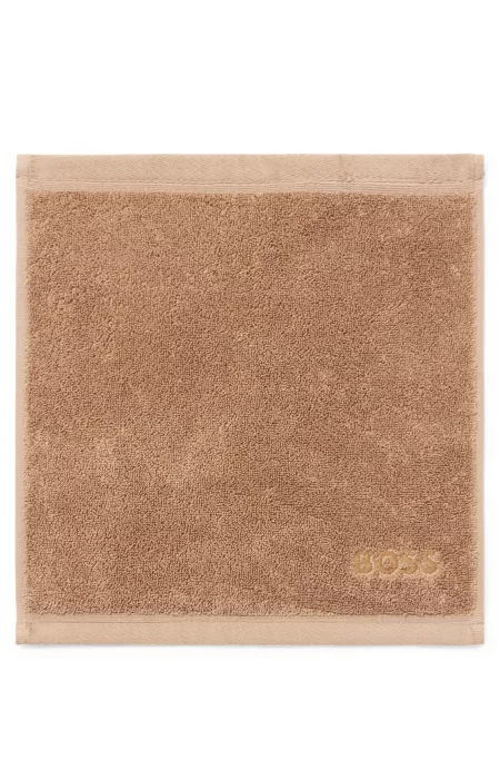 Aegean-cotton face cloth with tonal logo