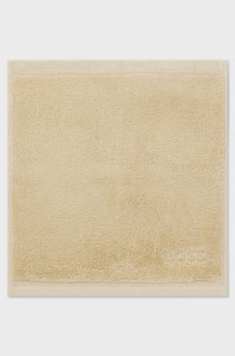 Aegean-cotton face cloth with tonal logo, Beige