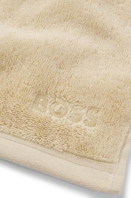 Aegean-cotton face cloth with tonal logo, Beige