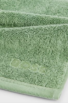 Waschlappen aus &auml;g&auml;ischer Baumwolle mit tonalem Logo, Gr&uuml;n