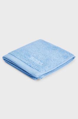 Aegean-cotton face cloth with tonal logo, Blue