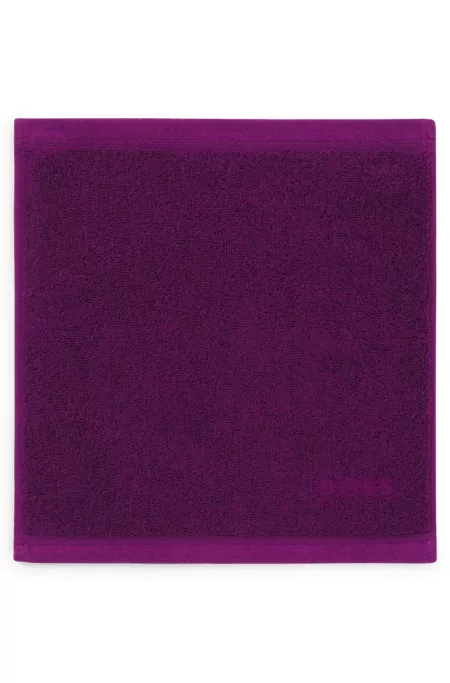 Aegean-cotton face cloth with tonal logo