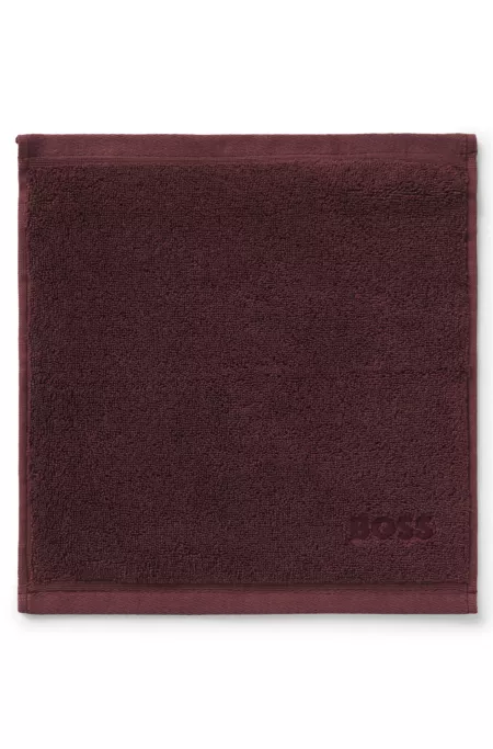Aegean-cotton face cloth with tonal logo