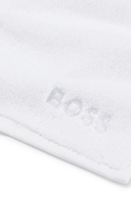Cotton face cloth with white logo embroidery, White