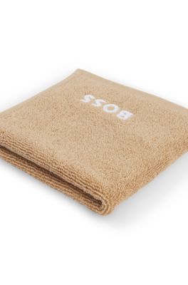 Cotton face cloth with white logo embroidery, Beige