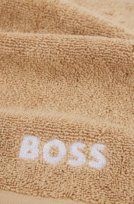 Cotton face cloth with white logo embroidery, Beige