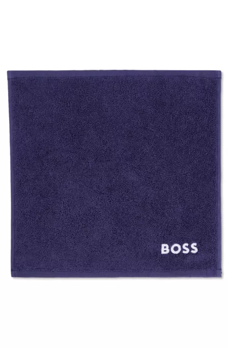 Cotton face cloth with white logo embroidery