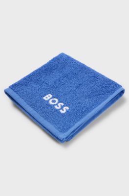 Cotton face cloth with white logo embroidery, Blue