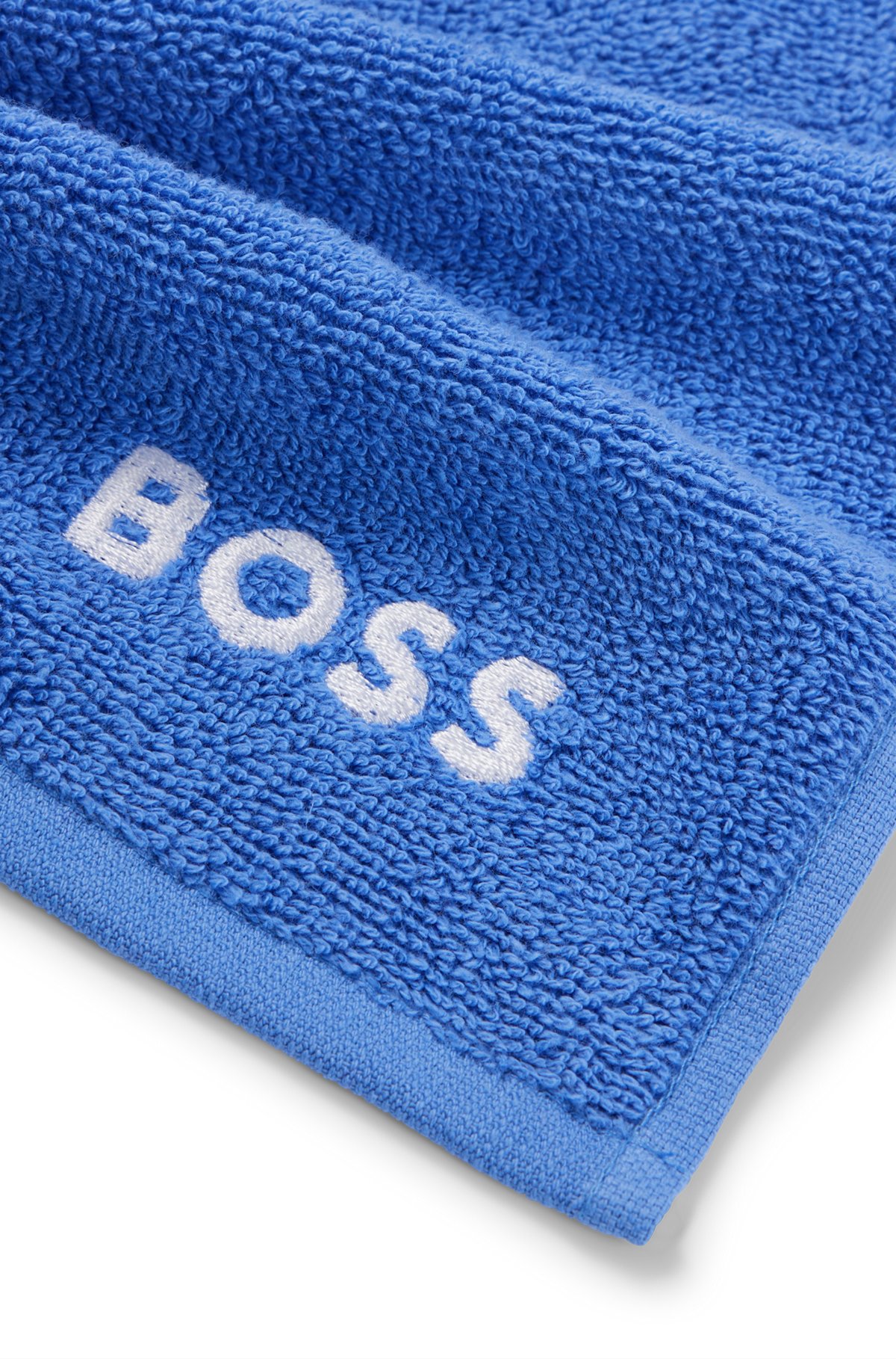 Cotton face cloth with white logo embroidery, Blue