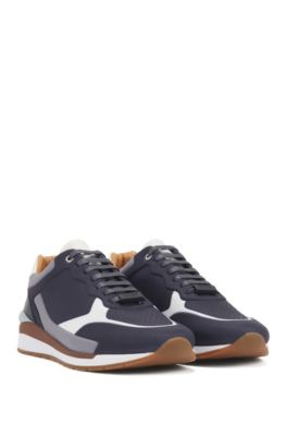 Running-inspired trainers in leather with monogram panels, Open Blue
